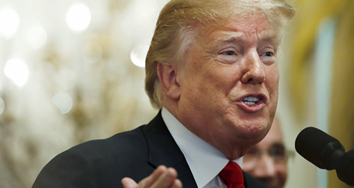 In this June 29, 2018 file photo, President Donald Trump gestures while speaking, during an event in the East Room of the White House in Washington.